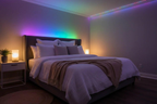 Smart Bluetooth RGB LED light strip glowing with vibrant colors and music sync in a cozy indoor setting
