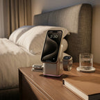 Smartphone, smartwatch, and Qi2 3-in-1 wireless charger on a nightstand with a bed in the background