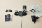 6-in-1 wireless charging station charging iPhone, smartwatch, and earbuds on a sleek desk setup