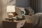 Sleek 6-in-1 wireless charging station charging iPhone, smartwatch, and earbuds on a desk