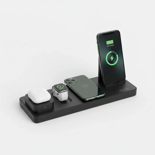 Black 6-in-1 wireless charging station with smartphone, watch, and mouse on a white background